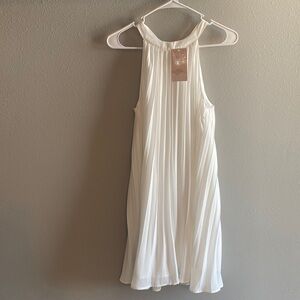 Beautiful white pleated A-line dress.Great for a wedding shower for a new bride.